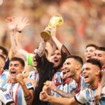 Lionel Messi lifts the World Cup trophy